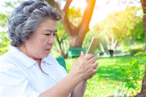 Grandma Or Older Woman Practice Playing Social Media By Using