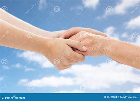 Close Up Of Senior And Young Woman Holding Hands Stock Image Image Of