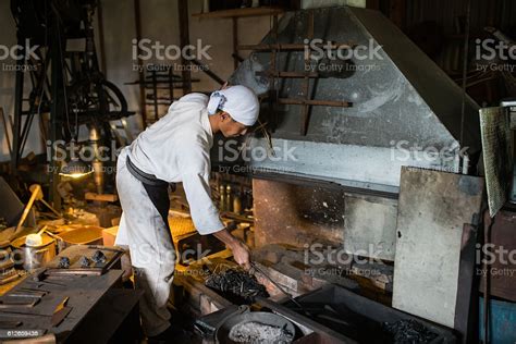 Japanese Blacksmith Prepares A Fire To Forge A Sword Stock Photo