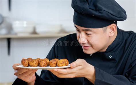 Portrait Close Up Handsome Professional Japanese Male Chef Wearing Black Uniform Hat Cooking