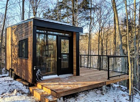 Lovely Off Grid Tiny House With Dual Bed Design And Garage Door Window