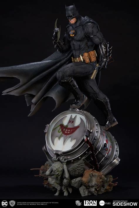 The Dark Knight Batman Statue Is On Top Of A Clock With An Inscription