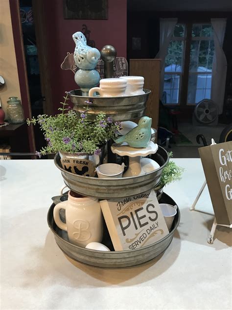 This tutorial shows you how to make a tier tray stack used in farmhouse style home decor using metal tray hacks from the dollartree. My first farmhouse style 3 tiered tray | Tray decor ...