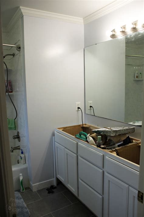 Choose the location of your bathroom mirror. How to Hang a Frameless Oval Mirror - Pretty Handy Girl