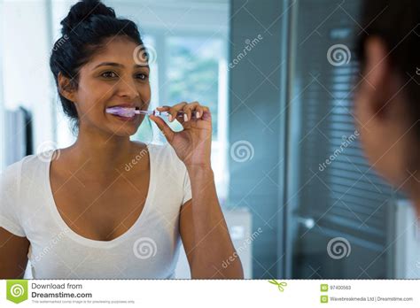 Woman Brushing Teeth Stock Image Image Of Brushing Looking 97400563