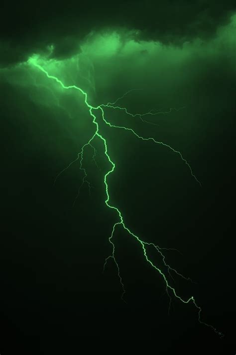 A Green Lightning Bolt In The Dark Sky