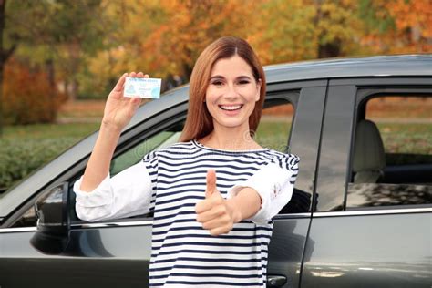 Happy Woman Holding Driving License Stock Photo Image Of Outdoors