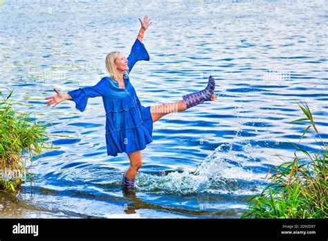 Woman Wading In Water In A Dress Hi Res Stock Photography And Images