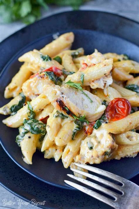 This tuscan chicken pasta is a mixture of chicken, mushrooms, kale and tomatoes, all sauteed and served over creamy pasta. Tuscan Chicken Pasta Recipe - Butter Your Biscuit | Recipe ...