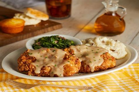 Hamburger steak with onions and gravy. Cracker Barrel Old Country Store launches simplified menu offering New Signature, Craveable ...
