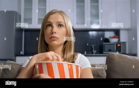 Beautiful Blonde Enjoying Popcorn And Movie Concept Of Watching Film