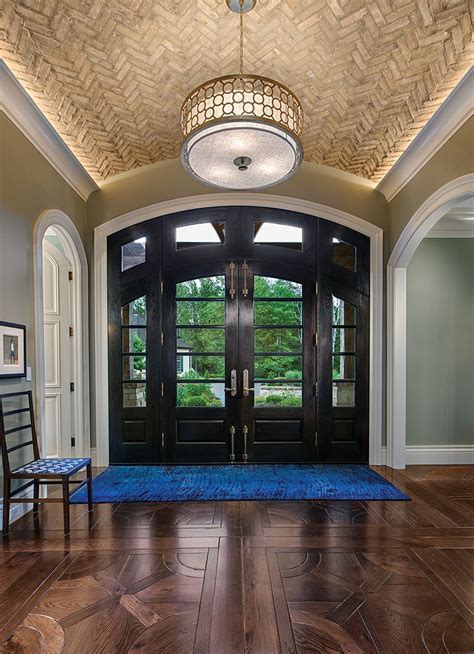 A Herringbone Patterned Brick On The Foyer Ceiling Is A Textural And