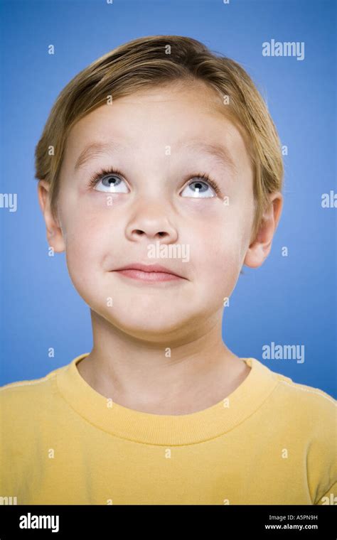 Portrait Of A Young Boy Looking Up Stock Photo Alamy