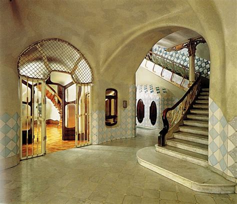 A Large Hallway With Arched Doorways And Stairs