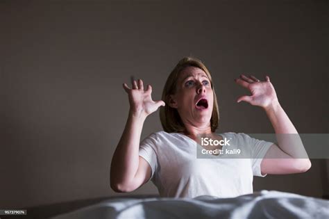 Woman In Bed Woken Up By Something Frightful Stock Photo Download