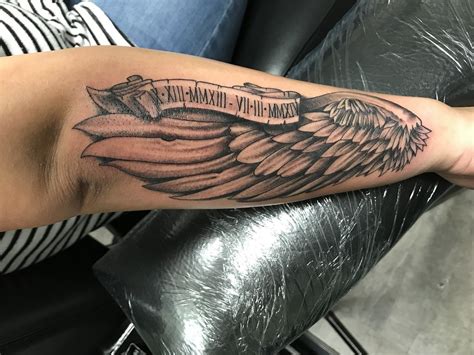 Angel Wing And Date Tattoo By Wes Fortier Burning Hearts Tattoo Co