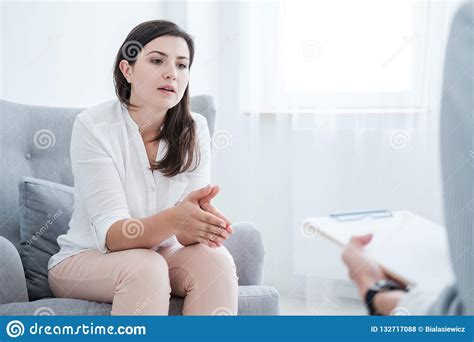 Woman With Problem Talking To Psychotherapist During Therapy In The