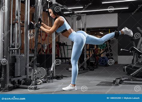 Fitness Woman Doing Exercise For Glutes Cable Kickbacks Athletic Girl