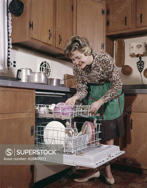 1960s Woman Apron Dishwasher Housework Kitchen Superstock