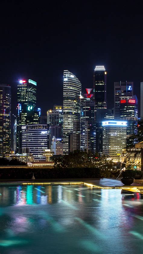 Download Wallpaper 1080x1920 Singapore Light Show Night Skyscrapers