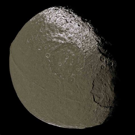 Saturns Two Faced Walnut Shaped Moon Iapetus Spaceopedia