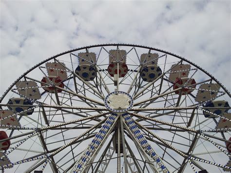 Free Images Ferris Wheel Amusement Park Clouds Symmetry Tourist