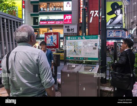 Men In A Outdoors Public Smoking Area In Shibuya Kanto Region Tokyo