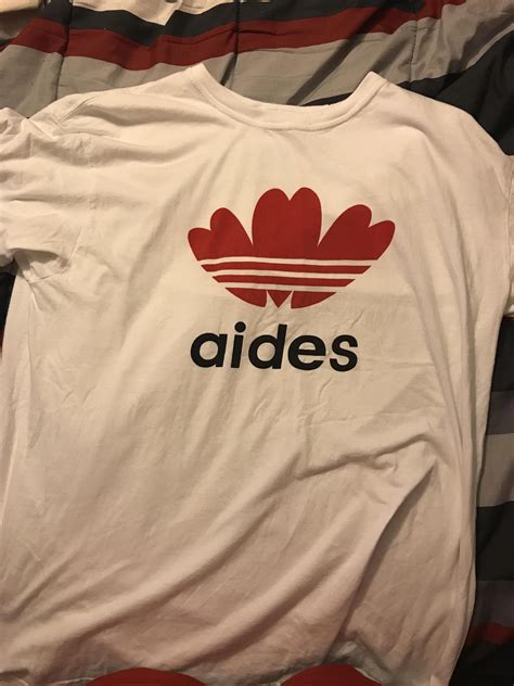 This Knock Off Adidas Shirt Says Aides Stupid Images Funny Images