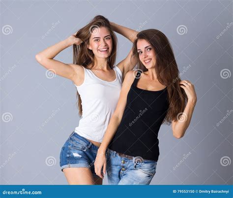 Two Young Women Smiling Stock Photo Image Of Posing 79553150