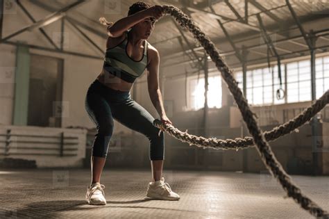 Athlete Working Out With Battle Ropes At Cross Gym Stock Photo 142243