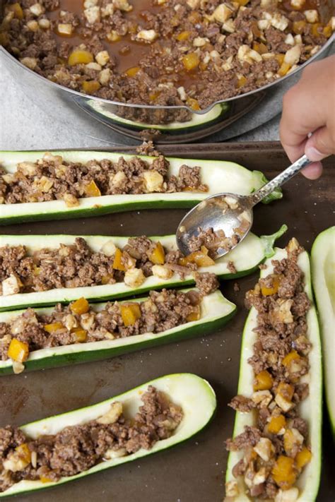 Simply mix rice, frozen veggies and ground beef into a simple easy to make sauce. Picadillo Zucchini Boats - Muy Bueno Cookbook