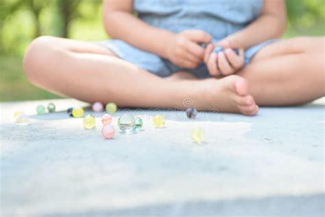 Boy Playing Marbles Game Outside Stock Image Image Of Hands Reaction