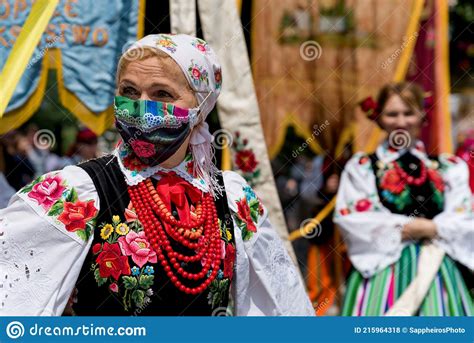 Woman Dressed In Polish National Folk Costume From Lowicz Region And Face Protective Mask
