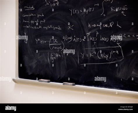 Algebraic And Calculus Equations In Chalk On A Blackboard Used In A