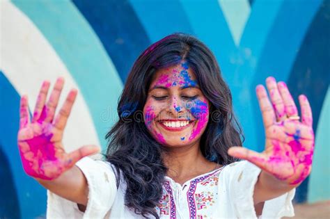 Holi Festival Of Colours Portrait Of Happy Indian Girl In Holi Color