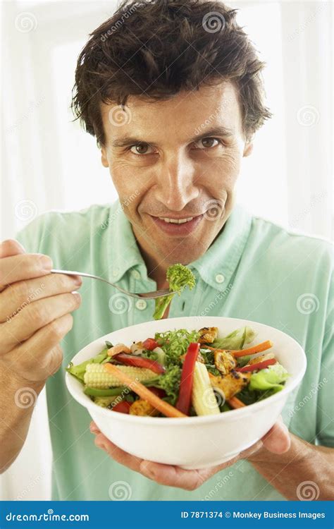Mid Adult Man Eating A Healthy Salad Stock Photo Image Of Camera