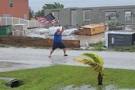 Florida man waves American flag in Hurricane Ian's face