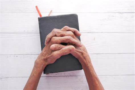 Premium Photo Senior Women Holding A Bible In His Hands And Praying
