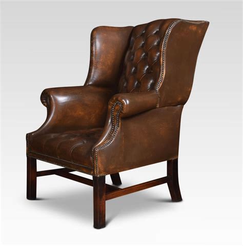 Use it as an accent chair in the living room, as a side chair in the bedroom or as a stylish. Brown Leather Upholstered Wingback Armchair For Sale at ...