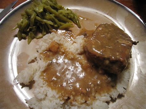 Pork chop with mushroom sauce. pork chops with cream of mushroom soup in oven with rice
