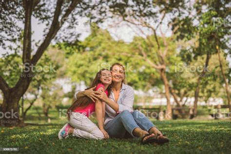 Portrait Of Young Happy Beautiful Mother And Daughter Hugging Stock