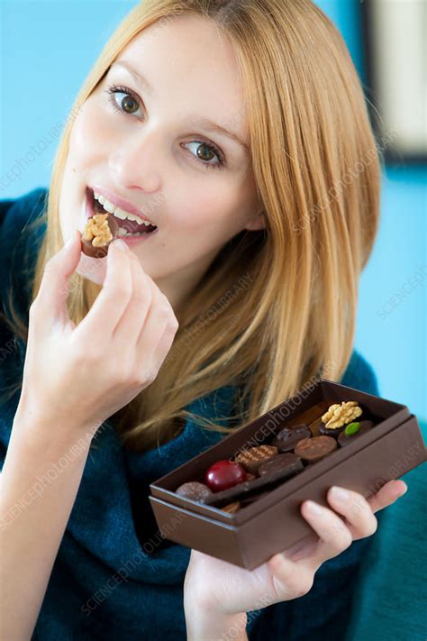 Woman Eating Chocolate Stock Image C033 1822 Science Photo Library