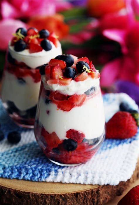 fresh sweet and tart strawberries and blueberries layered with mascarpone yogurt cream is a