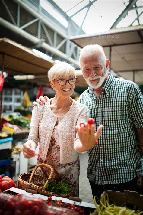 Bio.fm is a beautiful way to share your youtube, instagram, twitter, and more content with just. Senior family couple choosing bio food fruit and vegetable on the market during weekly shopping ...