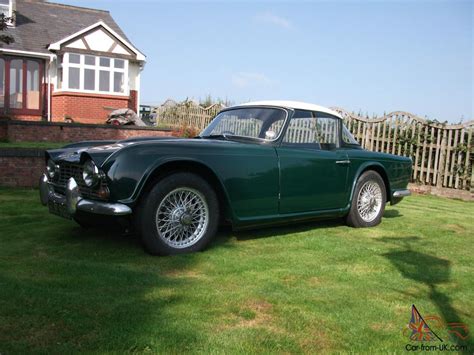 The marble chips are floated atop a layer of clay or concrete, creating a form of mosaic. TRIUMPH TR4 GREEN 1964