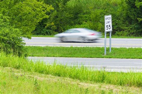 Speeding Car Streaks By Speed Limit Sign Stock Image Image Of Streaks
