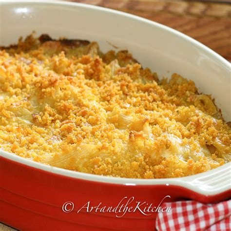 Then, stir in some shredded cheddar cheese, drained tuna, and cooked macaroni until all of the ingredients are thoroughly combined. Classic Tuna Casserole | Art and the Kitchen