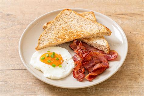 Fried Egg With Bread Toasted And Bacon For Breakfast 2949431 Stock