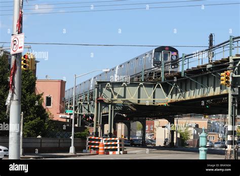 Elevated Subway Train Traveling Over A Street In Brooklyn New York Usa