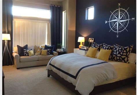 The bedroom is the most vital place in the house as this is. Navy blue accent wall/ yellow accents/ master bedroom ...